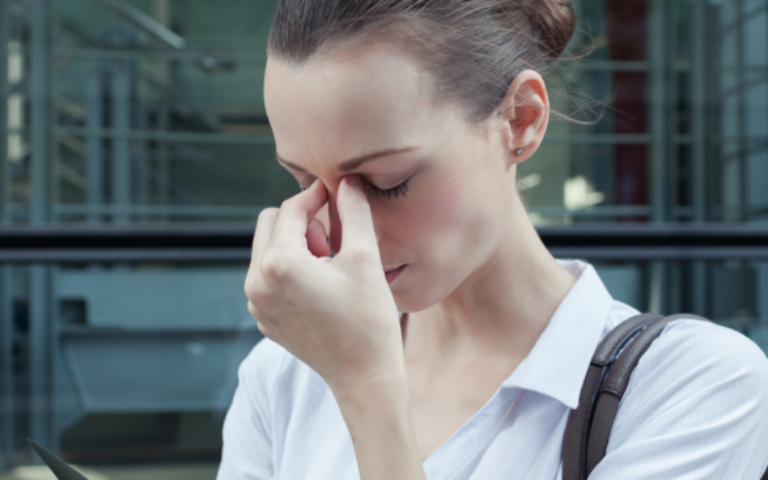 Image of frustrated woman at work